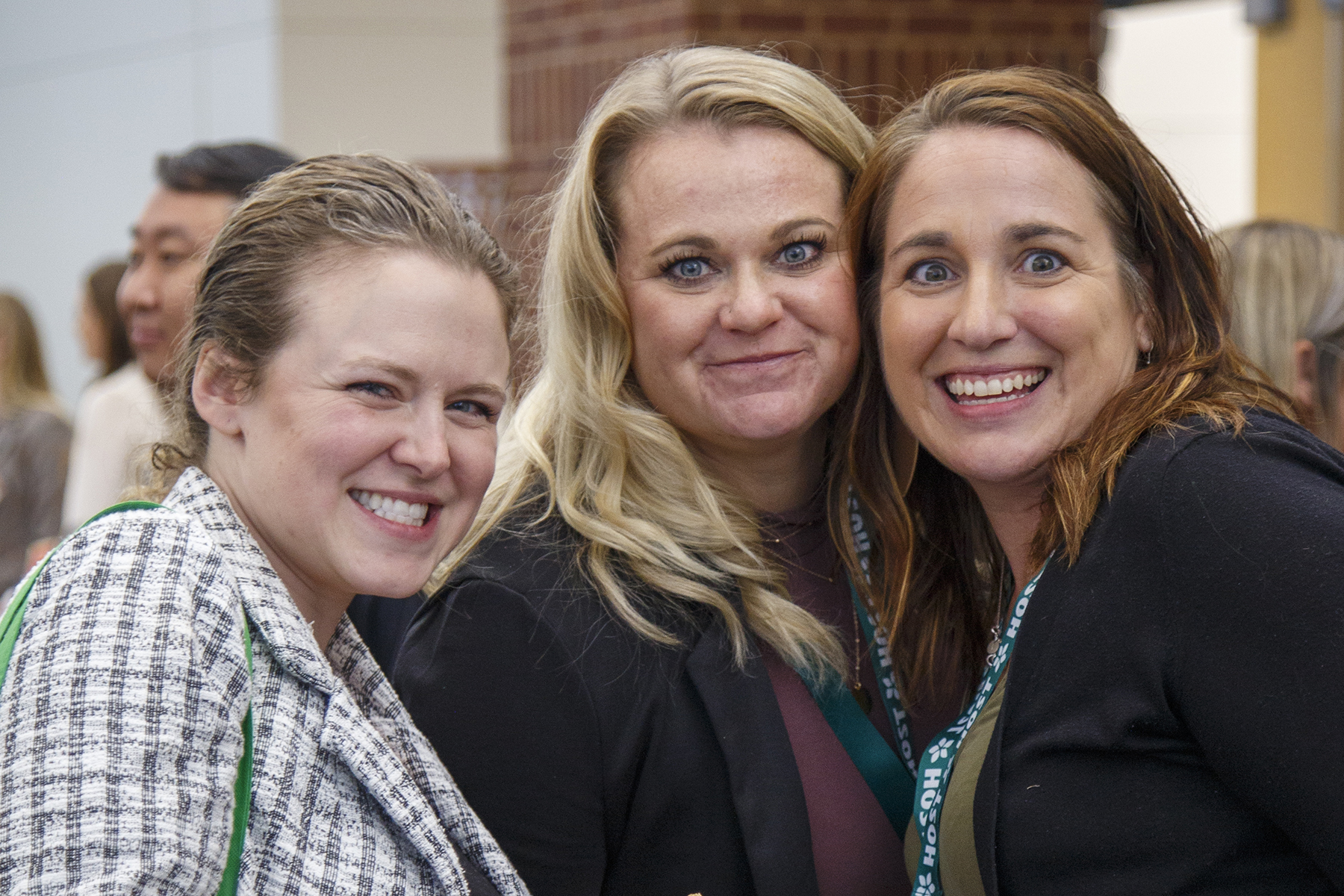 3 women smiling at camera at Conference