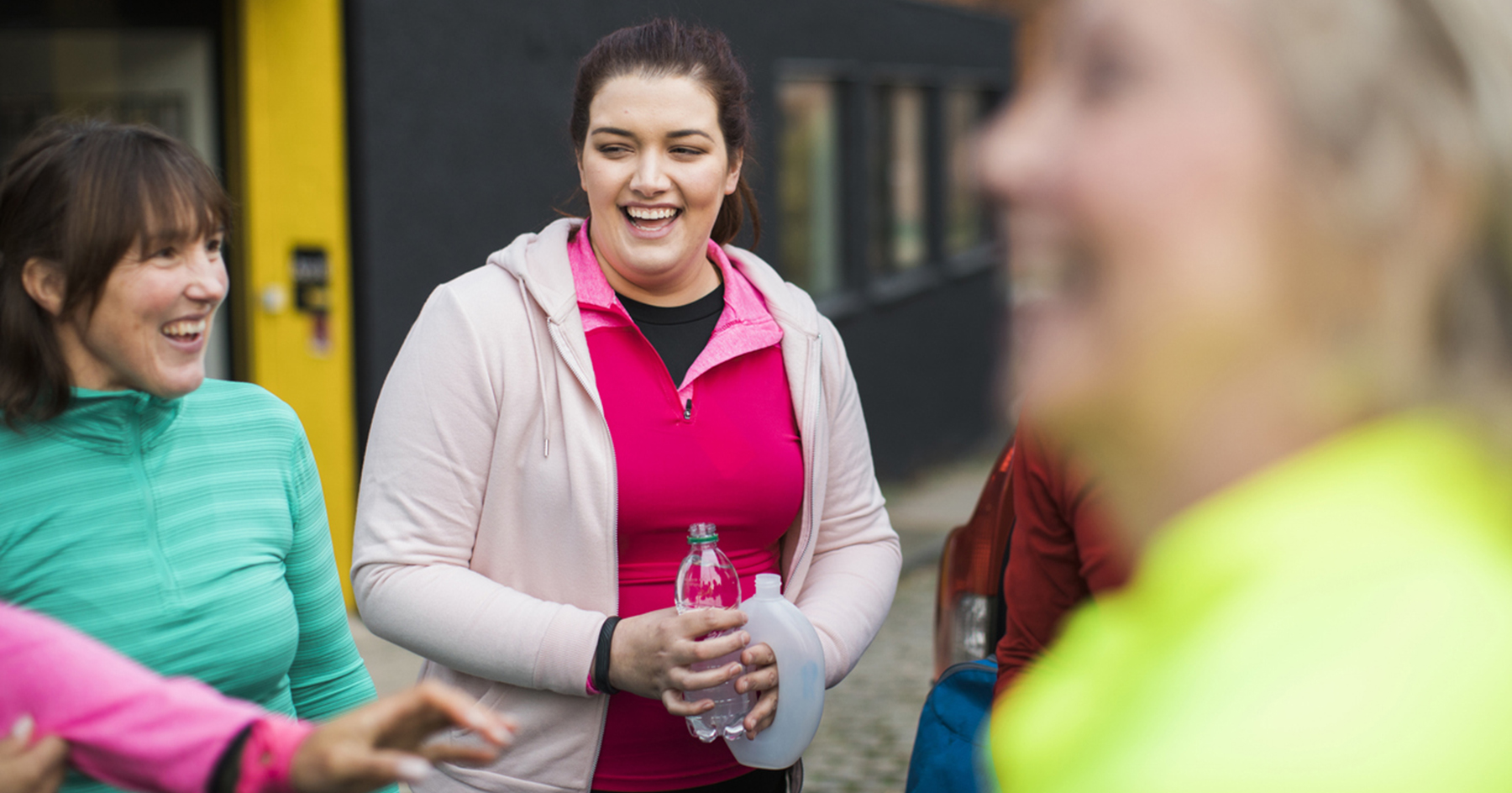 group of teachers laughing after exercising