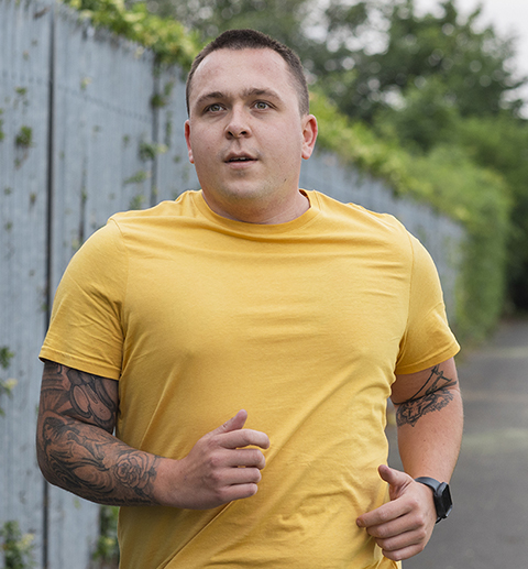 man jogging wearing yellow shirt