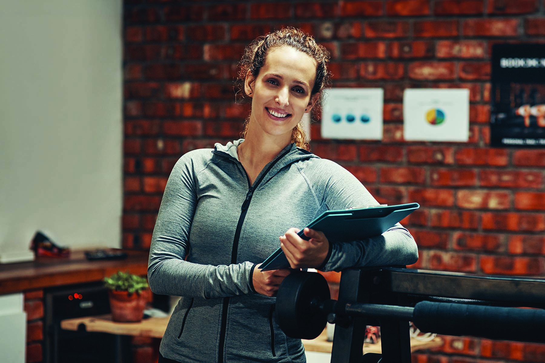 Cropped shot of a fitness instructor holding a clipboard