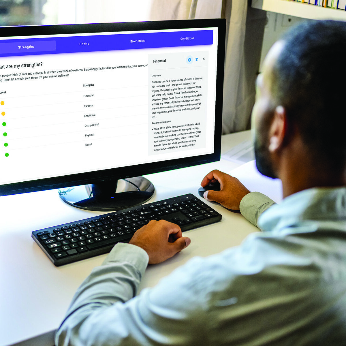 Man using computer monitor to view health portal